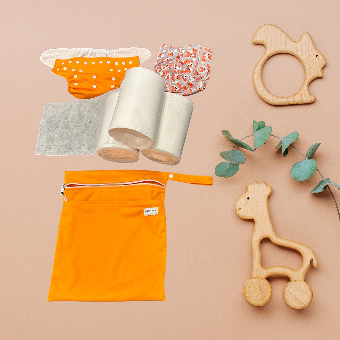The At Ease Baby Cloth Diaper Kit, showing two reusable covers and disposable bamboo liners