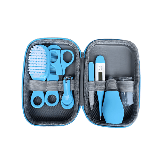 The At Ease Baby Complete Grooming and Healthcare Kit, showing the included digital thermometer and safe nail clippers