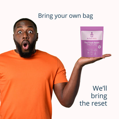 The Fresh Reset emergency on-the-go diaper change kit with diapers, wipes, a onesie, and hand sanitizer.
